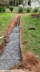 French Drain being installed on charlotte lawn