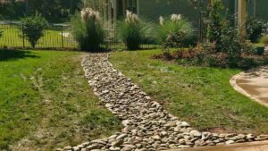 Build a Stylish Dry Creek Bed in charlotte lawn