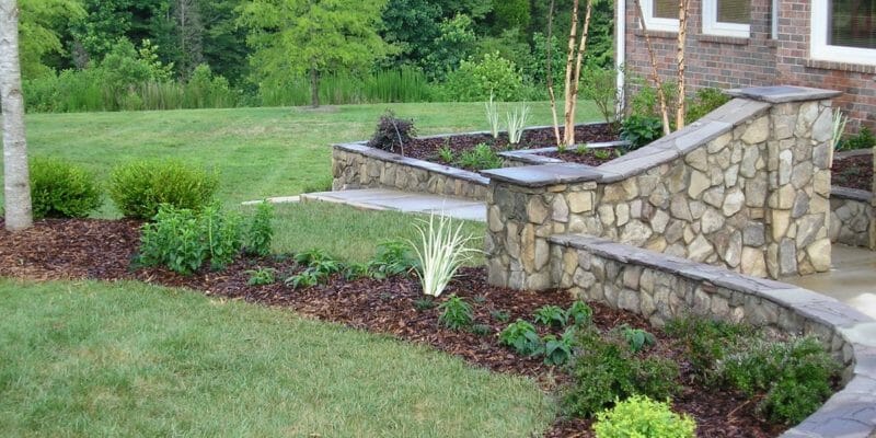 landscaping design with mowed lawn and retaining walls