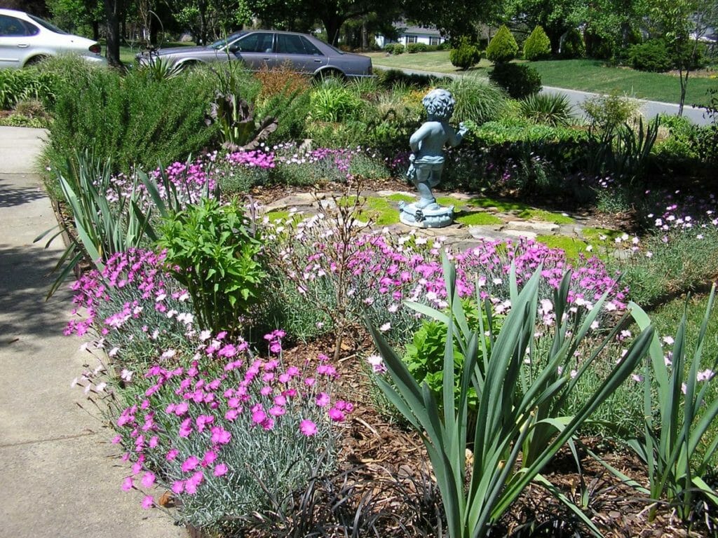 lawn maintenance featuring shrub trimming and planting