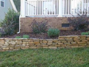 retaining walls and garden bed build for charlotte lawn