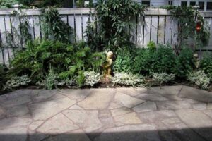 Hardscaping Projects in Charlotte, NC, featuring installation of stone slab patio