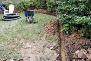 Top garden landscaping installing French drain around lawn in Charlotte, NC