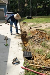 Top Garden installing Landscape Drainage and Irrigation Systems for Charlotte client