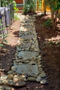Dry Rock Creek Bed for improving drainage at a Charlotte lawn