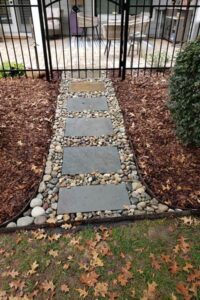 Landscape drainage and garden pathway services by Top Gardens Landscaping.