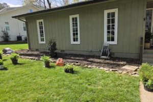 Mulch bed installation, natural stone edging, and lawn care by a top garden landscaping company in Charlotte, NC.